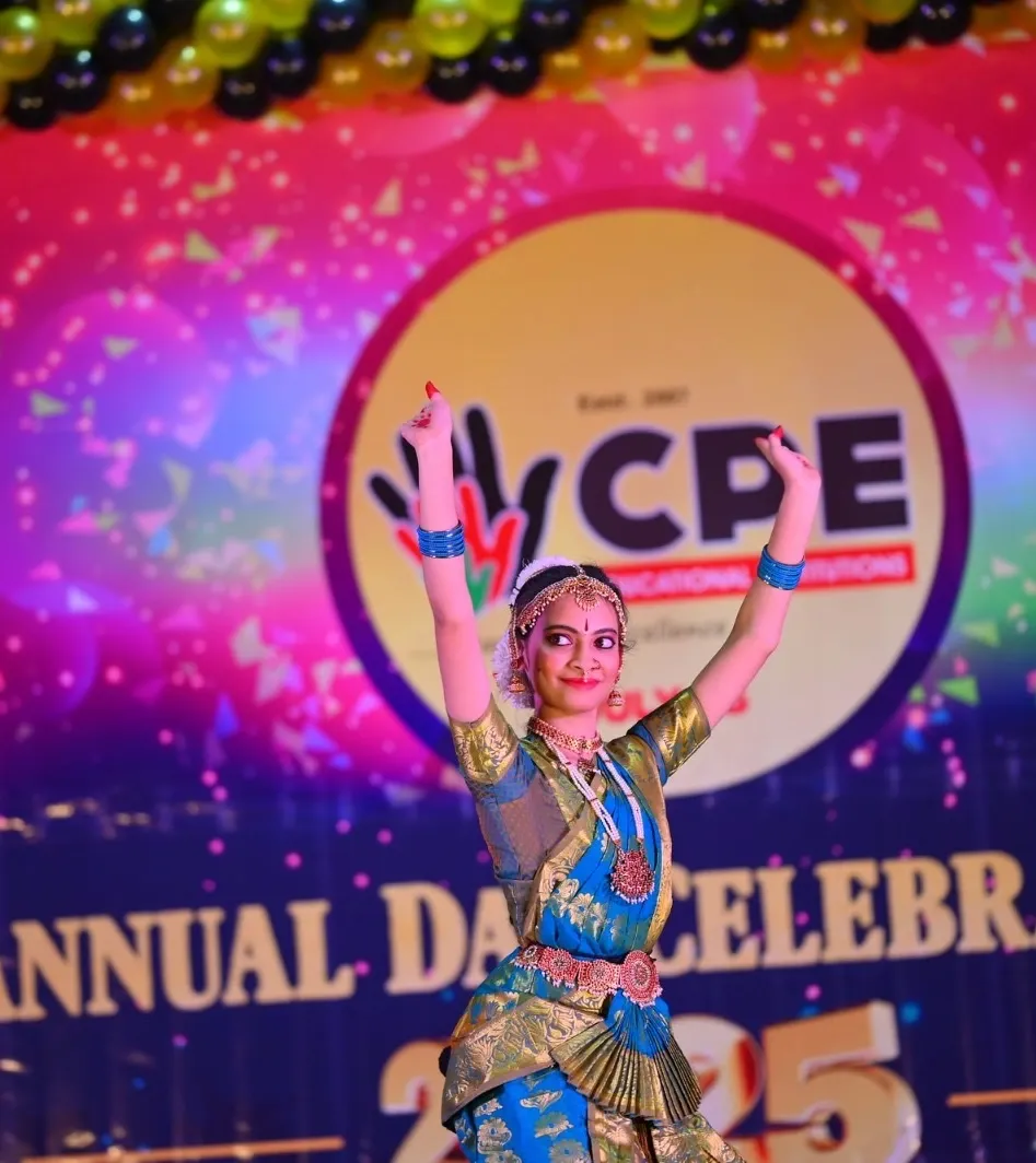 A student performing Bharatanatyam on the decorated Annual Day stage